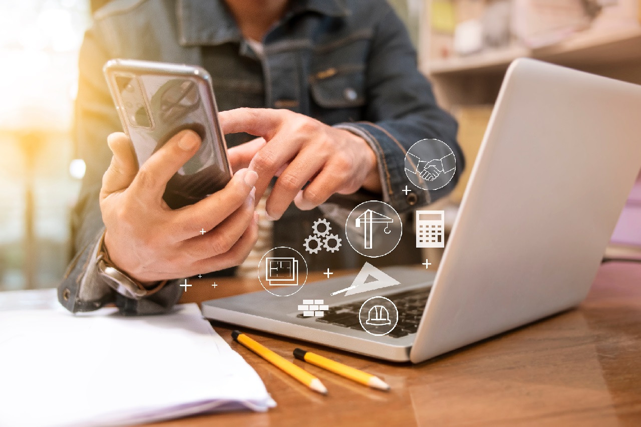 Engineer or Architect uses smartphones to meeting with suppliers